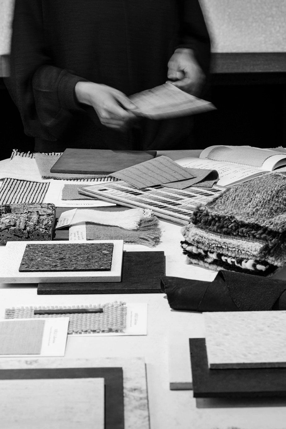 Material library table covered in fabric swatches